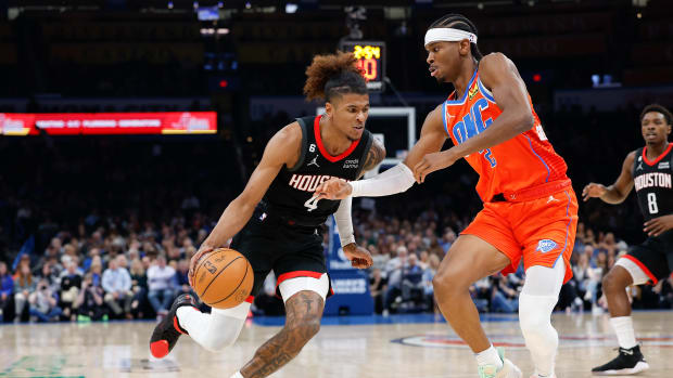 Thunder guard Shai Gilgeous-Alexander defends a drive by Houston Rockets guard Jalen Green during the second quarter at Paycom Center.